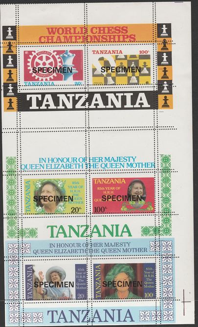 Tanzania 1986 Chess & Rotary, the unissued m/sheet (showing the Chess Championship Emblem) se-tenant with the two Queen Mother m/sheets (inscribed in error HRH) all  overprinted SPECIMEN and showing double perforations, unmounted mint. A remarkable piece from the Printer's archives, stamps on 