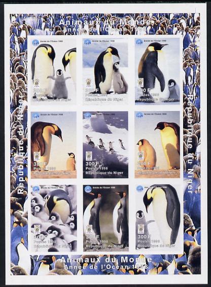 Niger Republic 1998 Animals of the World #5 (Penguins) imperf sheetlet containing 9 x 300f values each with Year of the Ocean logo unmounted mint. Note this item is privately produced and is offered purely on its thematic appeal as Scott #1010, stamps on animals, stamps on birds, stamps on penguins, stamps on polar, stamps on oceans