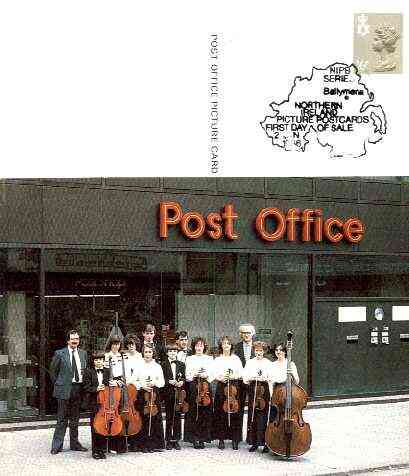 Postcard of Belfast Youth Orchestra outside Post Office (PO picture card NIPB 1) used with illustrated first day cancel, stamps on postal, stamps on music