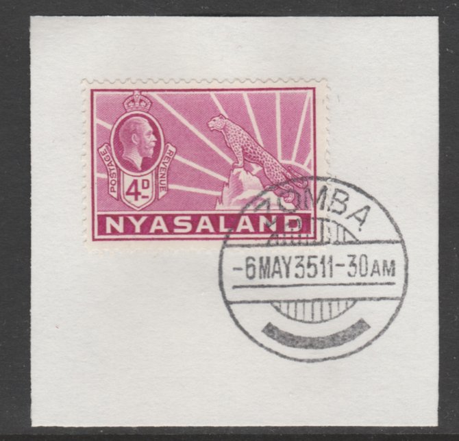 Nyasaland 1934-35 KG5 Leopard Symbol 4d magenta SG 119 on piece with full strike of Madame Joseph forged postmark type 314, stamps on , stamps on  kg5 , stamps on arms, stamps on leopard, stamps on cats