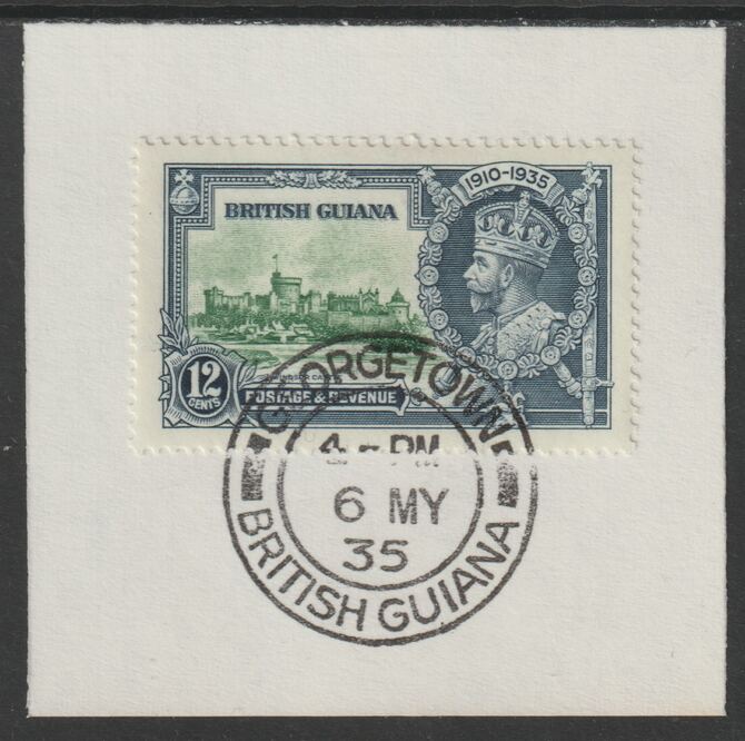 British Guiana 1935 KG5 Silver Jubilee 12c (SG 303) on piece with full strike of Madame Joseph forged postmark type 69 (First day of issue), stamps on , stamps on  stamps on , stamps on  stamps on  kg5 , stamps on  stamps on silver jubilee, stamps on  stamps on castles